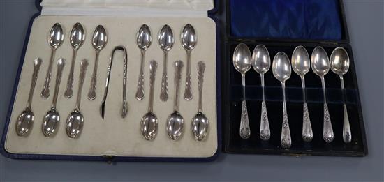 A cased set of 1920s twelve silver coffee spoons and tongs and a cased set of six silver teaspoons.